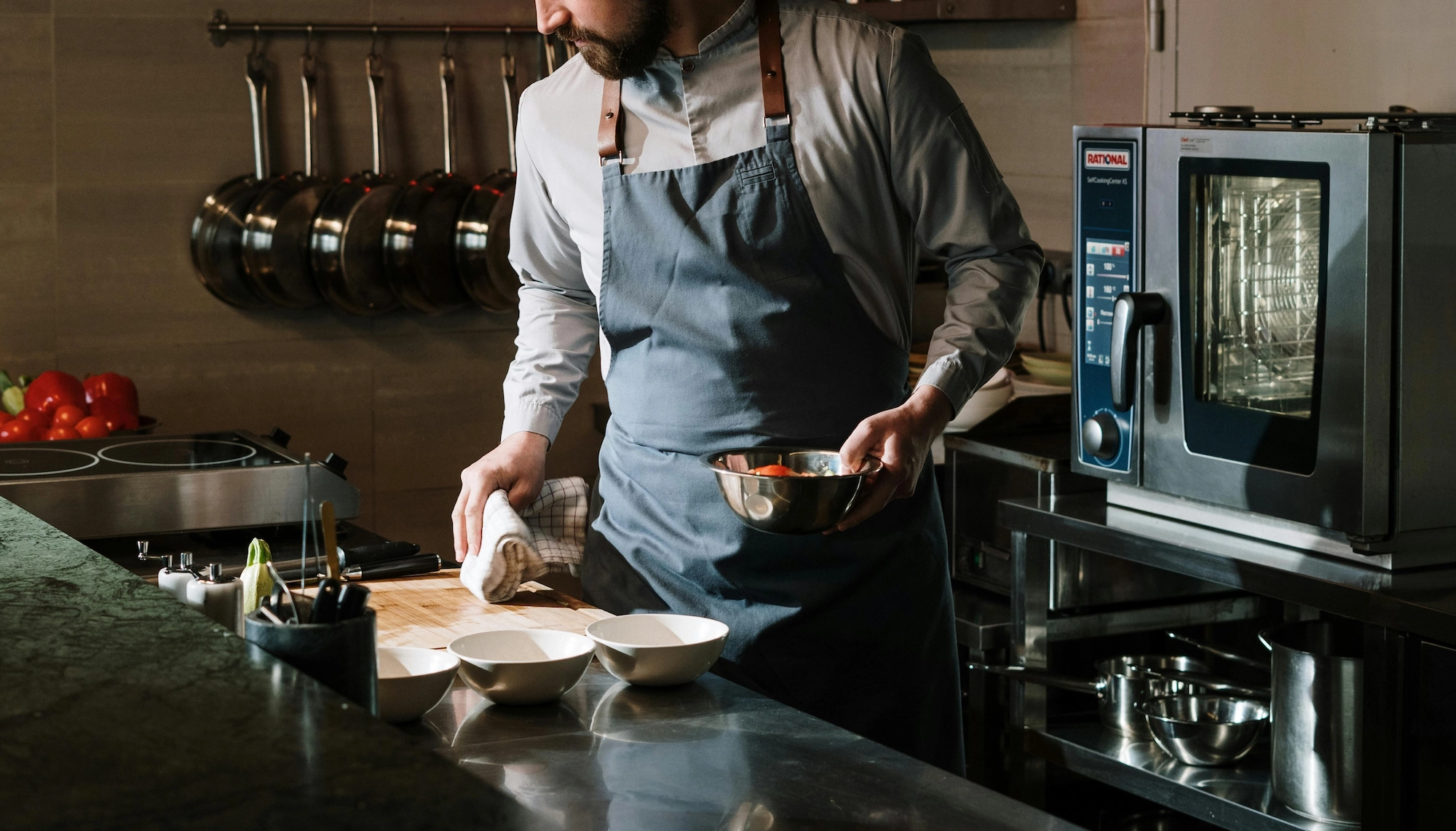 A vibrant overhead shot of prepared food dishes and ingredients, representing a busy kitchen.
